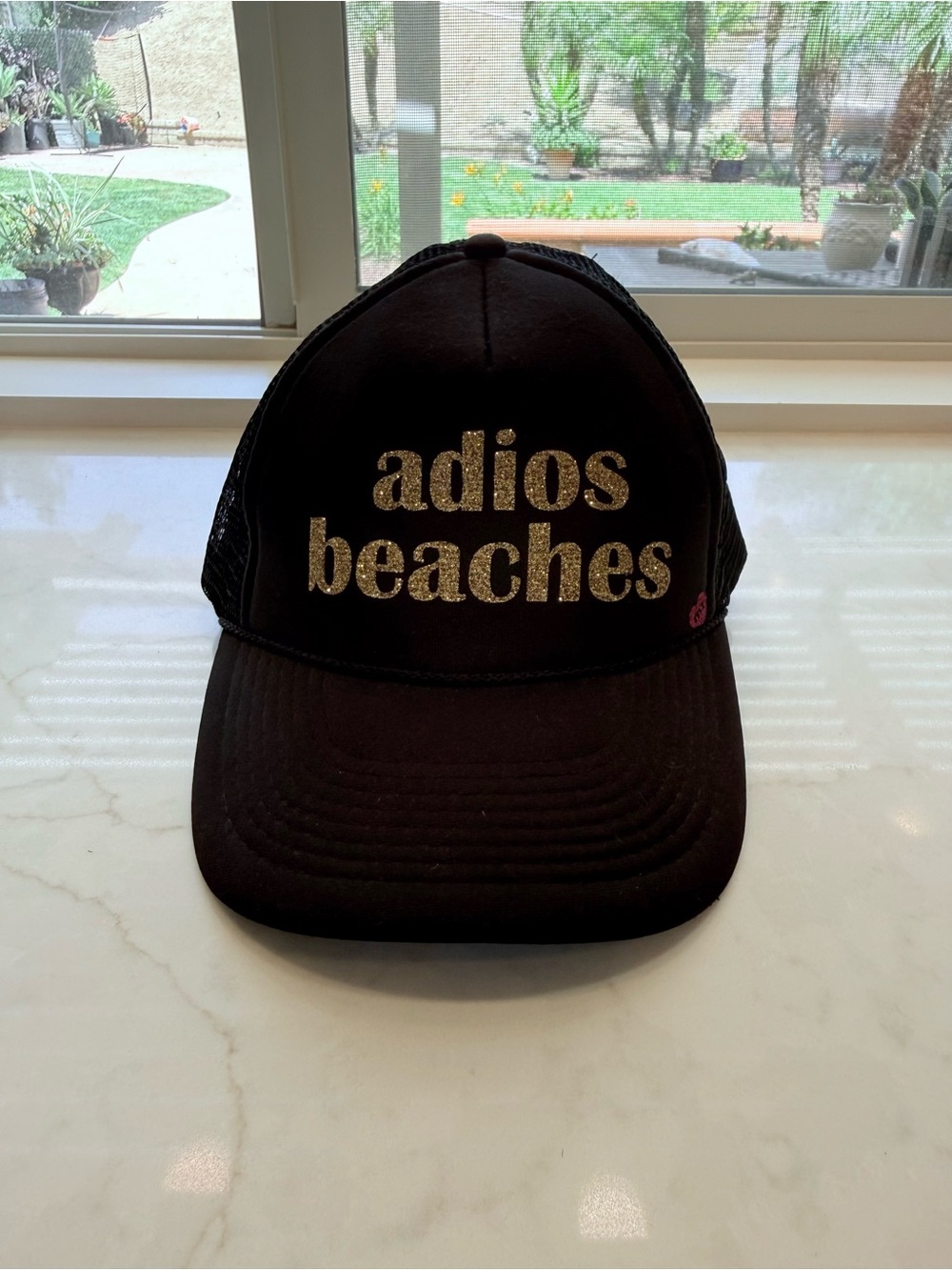 Black Mesh Trucker Hat with gold “adios beaches” logo. Adjustable fit. New